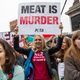 Illustration for article titled Chef with zero fucks left carves a deer leg in front of vegan protesters